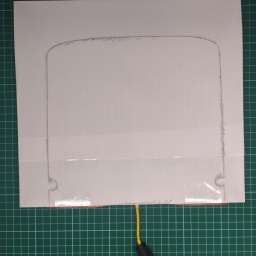 Using the old pencil tracing trick along the edge of the sensor does a quick job of giving you an accurate outline.